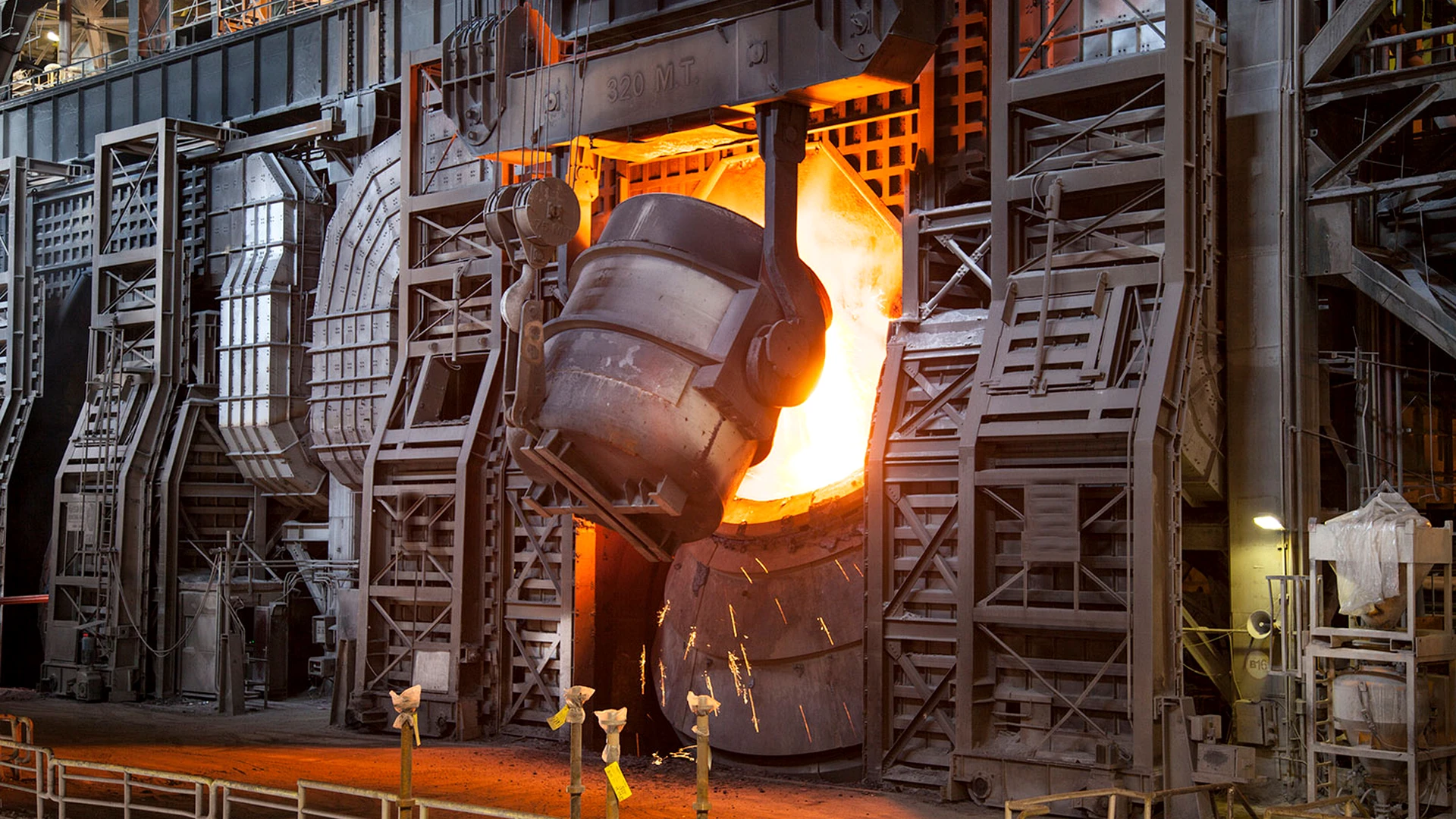 Molten steel being poured in an industrial foundry
